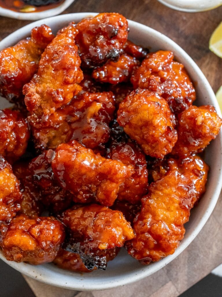 honey chipotle chicken bites in a white bowl