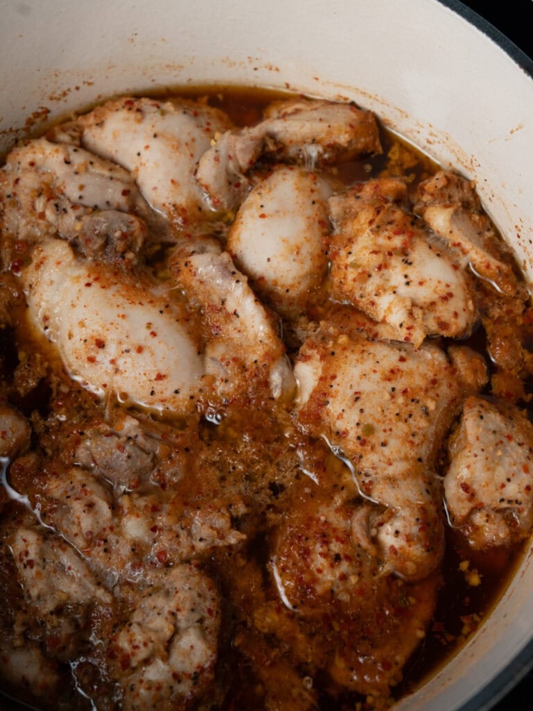 cooked chicken thighs in a Dutch oven