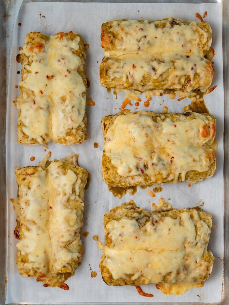 rotisserie chicken enchiladas on a sheet pan