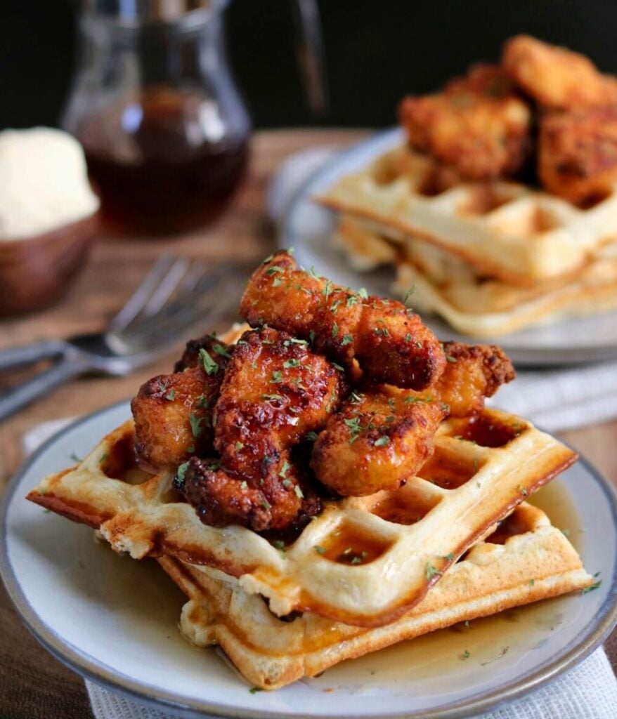 protein waffles topped with air fried chicken nuggets, butter, and syrup 
