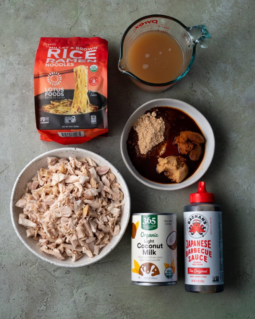 rice ramen, chicken bone broth, chopped rotisserie chicken, light coconut milk, Bachan's japanese barbecue sauce, and a bowl of white miso, powdered peanut butter, red curry paste, and coconut aminos