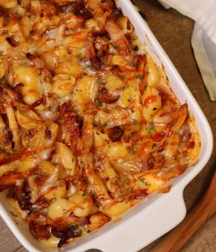 bbq chicken macaroni and cheese in a ceramic baking dish