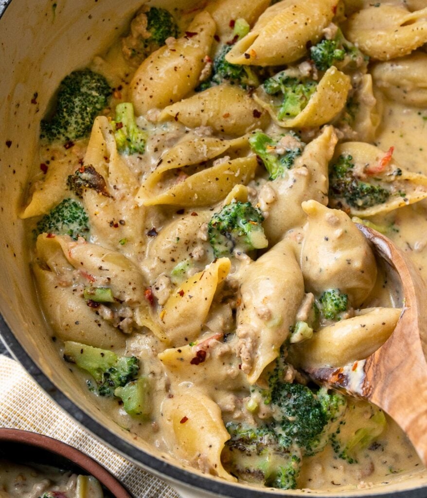 jumbo pasta shells with ground turkey and broccoli in a Dutch oven
