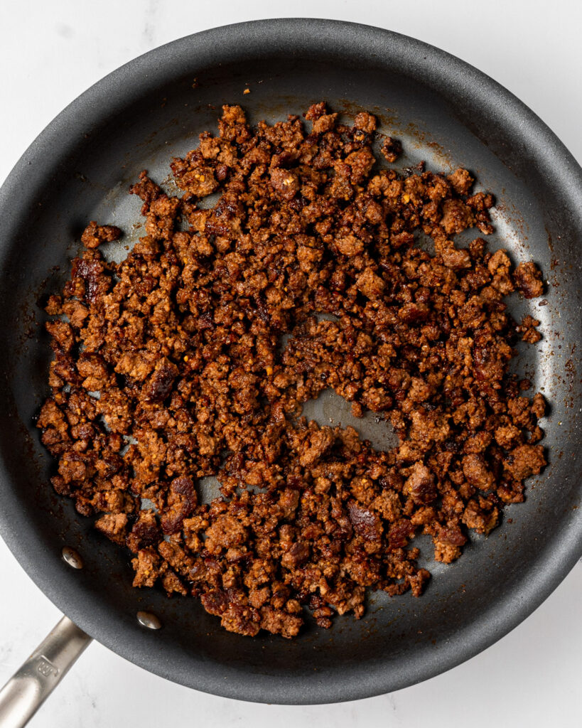 crispy ground beef with hoisin sauce in a nonstick skillet