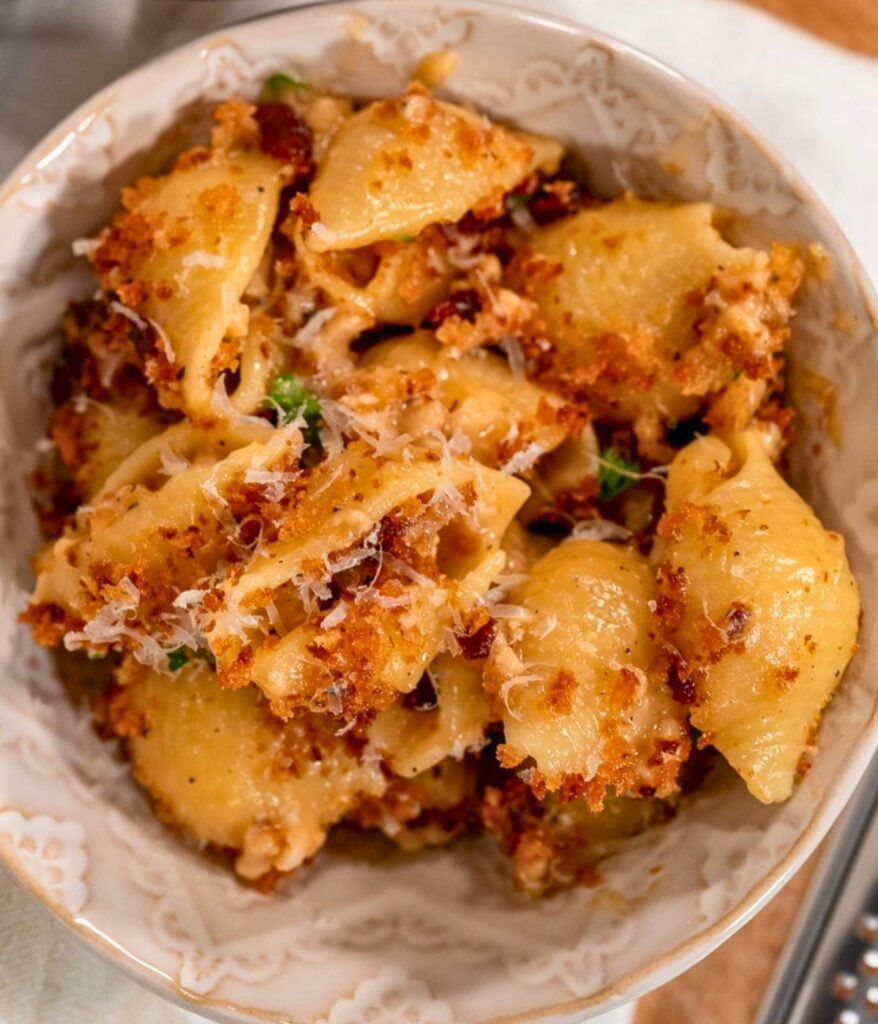 a bowl of high protein chicken mac and cheese with crispy breadcrumb topping