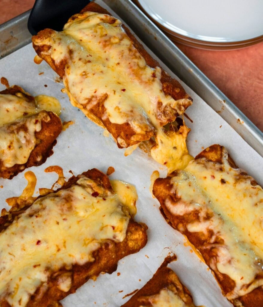 serving cottage cheese enchiladas off a sheet pan