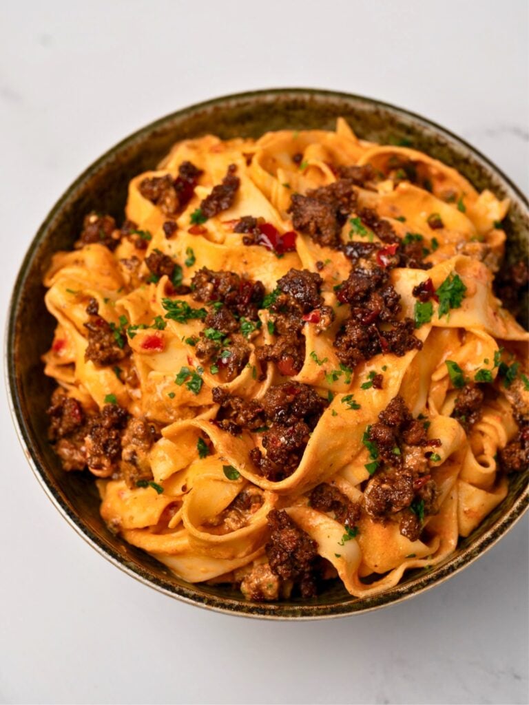 a bowl of creamy cottage cheese and ground beef pasta