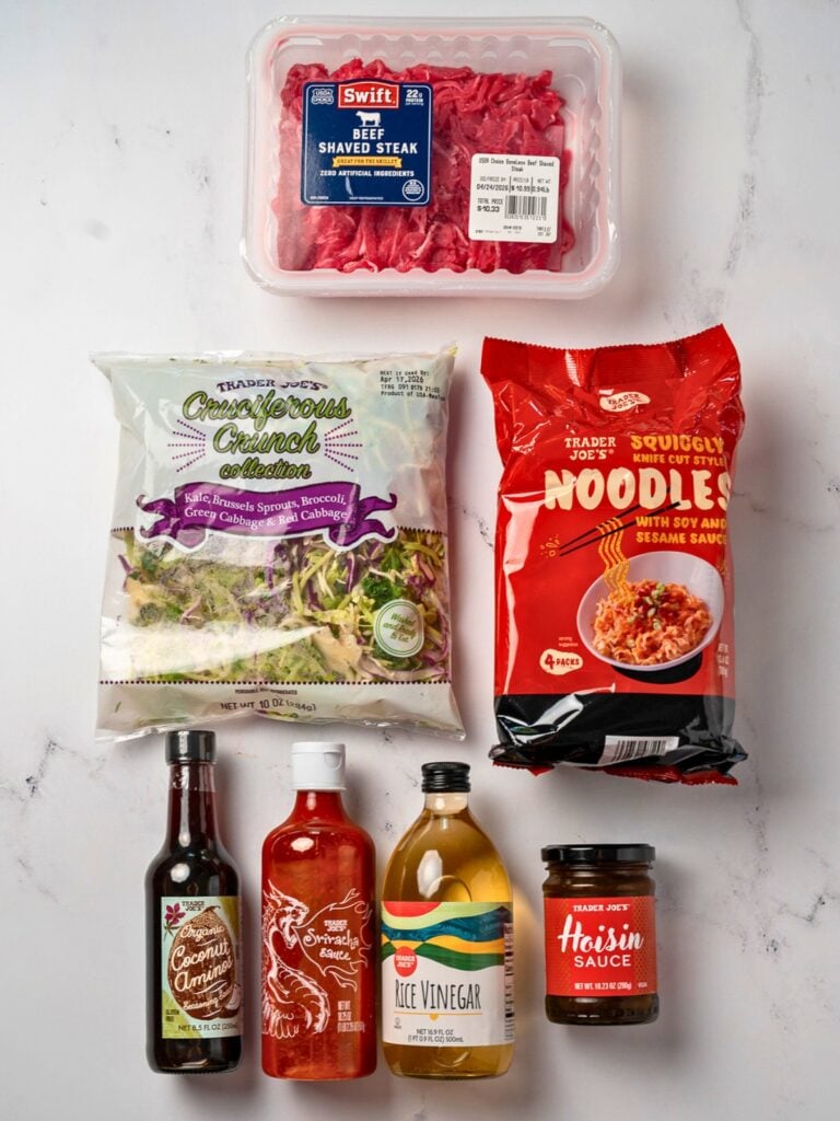 Trader Joe's knife cut squiggly noodles, cruciferous crunch veggies, coconut aminos, sriracha, rice vinegar, hoisin sauce, and beef shaved steak