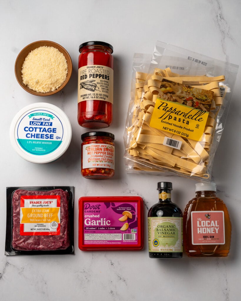 Trader Joe's pappardelle, roasted red peppers, parmesan, low fat cottage cheese, Italian bomba sauce, ground beef, garlic, balsamic vinegar, and honey