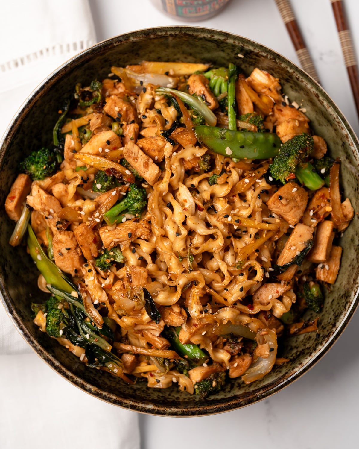 knife cut noodles stir fried with teriyaki chicken breast and stir fry veggies