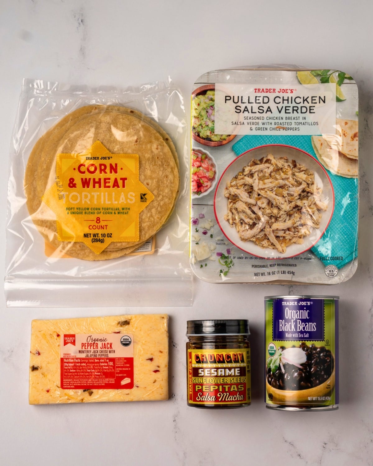 Trader Joe's salsa verde chicken, corn and wheat tortillas, pepper jack cheese, salsa macha, and canned black beans