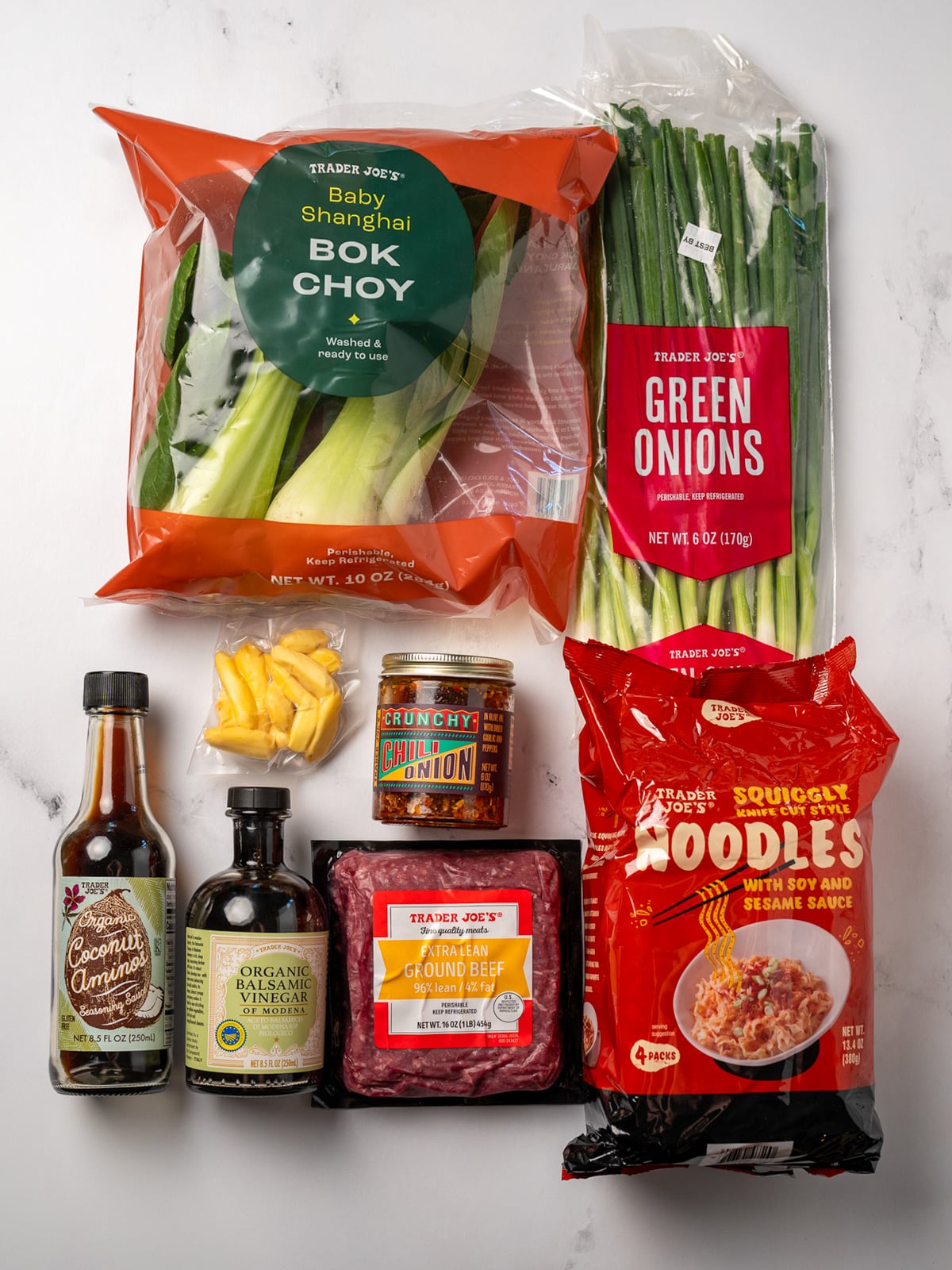 Trader Joe's bok choy, green onion, peeled ginger, coconut aminos, balsamic vinegar, crunchy chili onion, extra lean ground beef, and squiggly knife cut style noodles