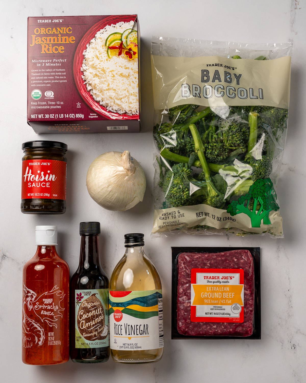 frozen steamed jasmine rice, baby broccoli, hoisin sauce, white onion, sriracha, coconut aminos, rice vinegar, and extra lean ground beef
