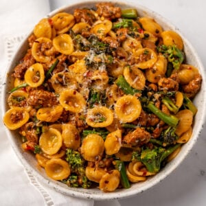 a white bowl of ground chicken orecchiette
