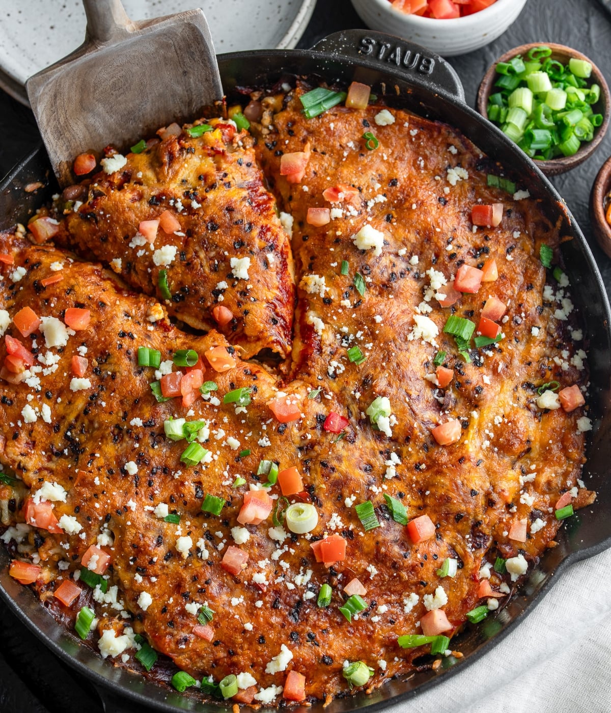 serving a slice of taco turkey casserole with a wooden spatula