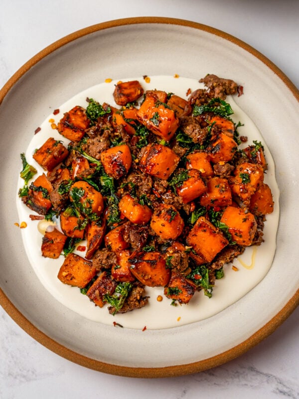 sautéed sweet potatoes and kale with ground beef served over whipped goat cheese