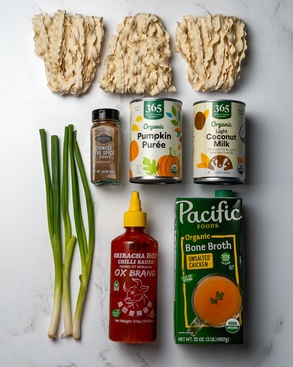 instant wheat noodles, green onions, canned pumpkin, light coconut milk, Chinese five spice, sriracha, and bone broth