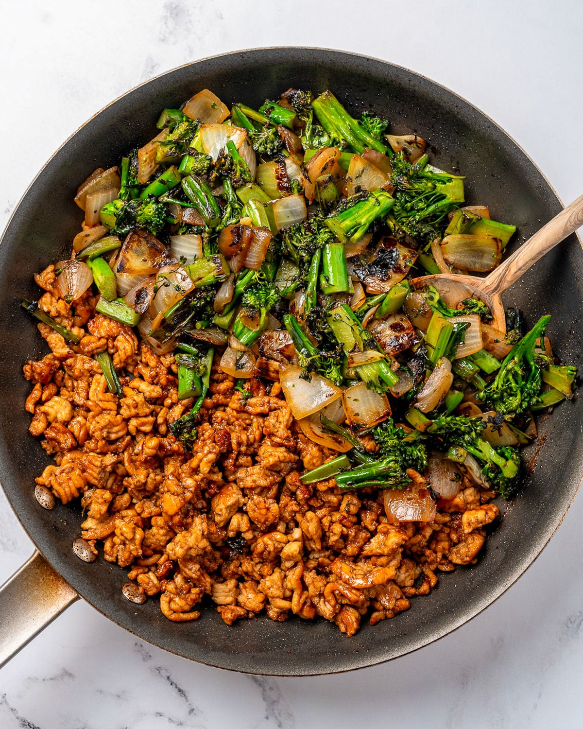 ground turkey and baby broccoli stir fry in a pan